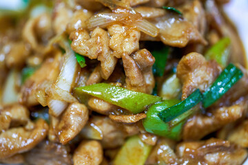 A delicious Chinese home-style dish, fried chicken thighs in Beijing green onion sauce