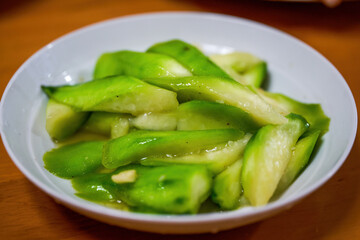 A plate of light and fresh Chinese home cooking, stir-fried loofah