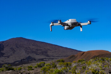Fototapeta na wymiar Drone protection flying during the day in volcano mountains, High quality photo