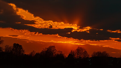Beautiful sunset view with dramatic clouds near Plattling, Isar, Bavaria, Germany