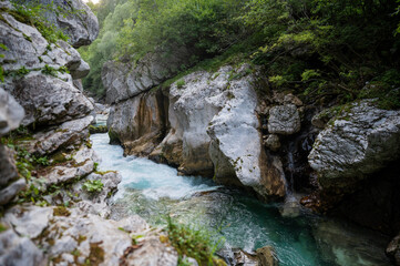 Fototapeta na wymiar Fast river of soca flowing through cliff of big gorge