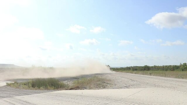 Military vehicle moving though training ground