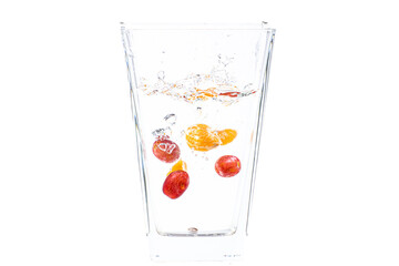 fruits fall into the glass