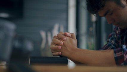 Prayer and bible concept.Man praying, hope for peace the world and free from war and coronavirus,...