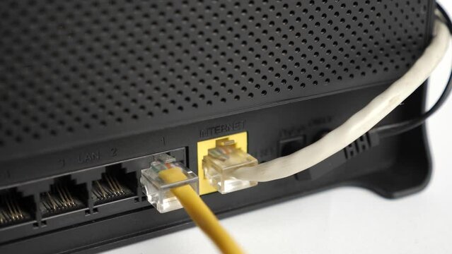 A network cable for connecting to the Internet is connected to the router.