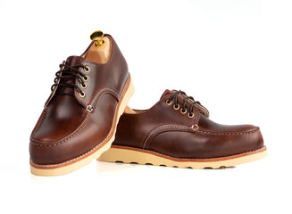 Men fashion brown shoes leather with shoe tree (shape supporter)  isolated on white background. Clipping path