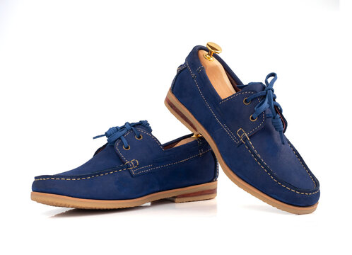 Men fashion blue leather boat shoes with shoe tree (shape supporter)  isolated on white background. clipping path