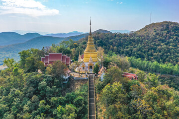 Aerial view of Wat Phra Phutthabat Tak Pha temple on top of the mountain in Lamphun, Thailand