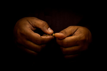 Muslim man hand for praying, Isolated on Dark Background. the concept for Ramadan, Eid al Fitr, eid...