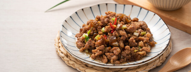 Taiwanese fried minced pork with pickled cucumber on rice named GUA ZI ROU FAN.