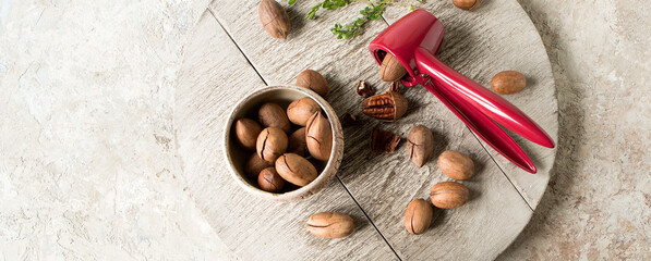 pecans and nutcracker on a light table