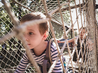 Happy kids in a rope park
