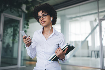 Millennial business woman use smartphone in office