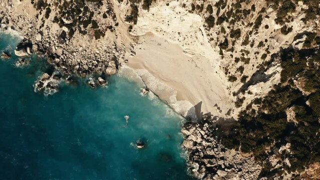 Aerial view of Ithaki beach waves in motion, Ionian Sea, Greece