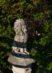 statue of a lion in a park in Italy 