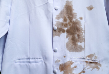 dirty sauce stain on white shirt from eating in home of daily life activity. dirty stains for...