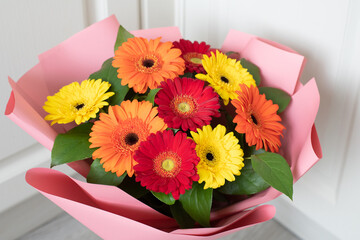 Bouquet of red, yellow and an orange gerberas