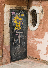 old building and door with graffiti in Italy 