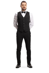 Full length portrait of a professional waiter with a bow tie and vest