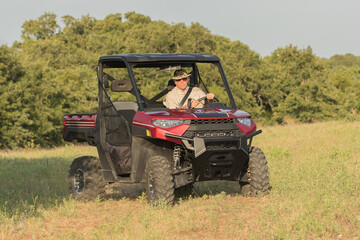 Fototapeta premium Man driving a UTV