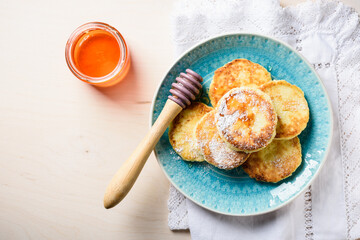 Cottage cheese pancakes with honey.