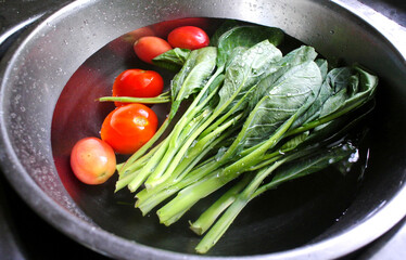 Fresh vegetables washed in sink