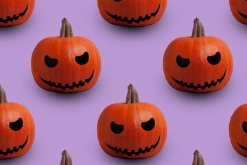 Halloween seamless pattern. Pumpkins on pastel background.