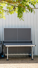 Close-up of a table tennis (ping pong table), half folded, outdoors