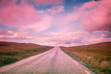 Fototapeta premium Driving a car on mountain road. Beautiful harsh nature of Northern Norway. Polar circle. The way to Nordkapp