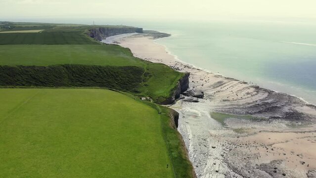 Aerial view of MonkNash Coast known as the Jurassic coast in South Wales uk. View of beach from a drone above during summer time
