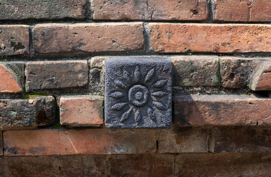 Red bricks with stone carving decoration for background