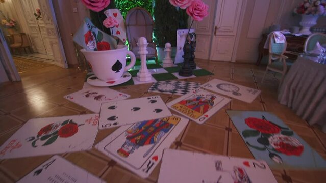 Decor in the style of Alice in Wonderland. decoration wedding banquet. Interior of a wedding hall decoration ready for guests. Beautiful room for ceremonies and weddings.Wedding concept. 