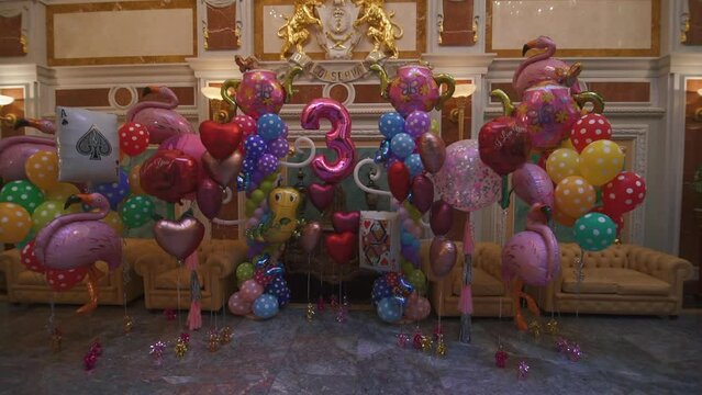 Happy third birthday, colored air balloons with number three, anniversary celebration with decorations. High quality FullHD footage