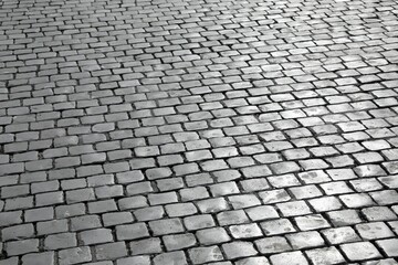 background of many cubic tiles called Sampietrini typical of the pavement of many European squares...