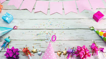 Happy birthday number 50. Copyspace. Beautiful card in pastel pink colors for a woman or a girl....