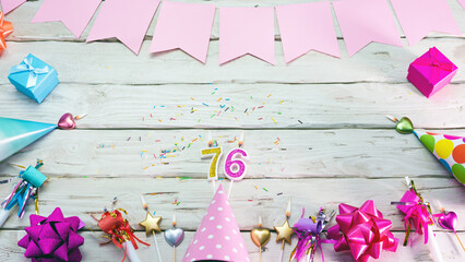 Happy birthday number 76. Copyspace. Beautiful card in pastel pink colors for a woman or a girl....