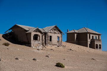 abandoned house filled with desert sand in kolmanskop,namibia
