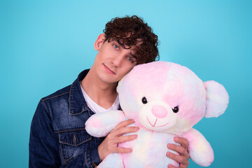 Holidays. Young attractive guy with a gift.	