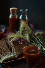 Traditional homemade beverage kvass in glass and bottles is a good summer cooling drink made from...