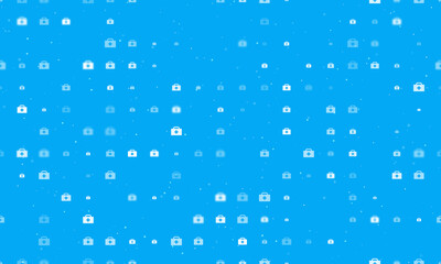 Seamless background pattern of evenly spaced white first aid symbols of different sizes and opacity. Vector illustration on light blue background with stars
