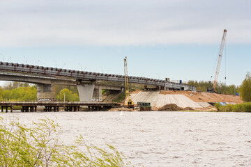 Construction of a modern bridge next to the old one
