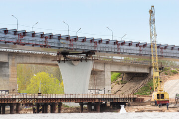 The work of the crane on the construction of a new bridge.