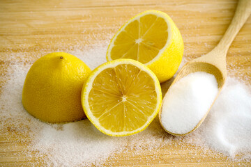 Fresh sliced lemon with salt on bamboo table. Use for safe home cleaning and DIY household nontoxic...