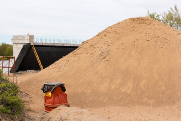 A pile of sand at a construction site.