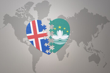 puzzle heart with the national flag of Macau and iceland on a world map background. Concept.