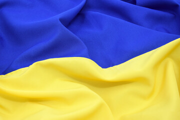 Fabric bent national flag of Ukraine, UA.
