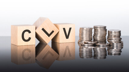 clv - text is made up of letters on wooden cubes lying on a mirror surface