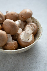 Close up of mushrooms in bowl on stone table