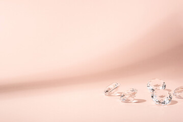 Pink background for product presentation with diamonds. Minimal concept and hard sunlight.