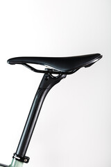 Bicycle saddle on a light background accessories for bike repair and tuning